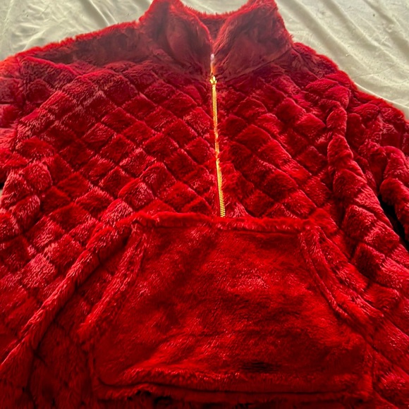 It’s a red jacket it has a working zipper. Very soft and comfortable. - Picture 2 of 3